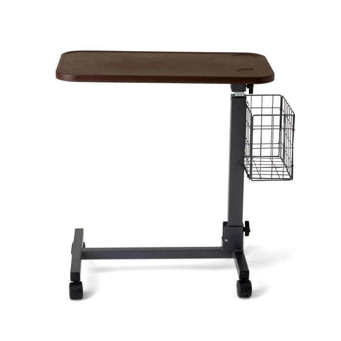 Overbed table for medical use features a basket accessory that folds flat for convenient, compact storage Durable, water-resistant composite material with spill edge and hammertone finish